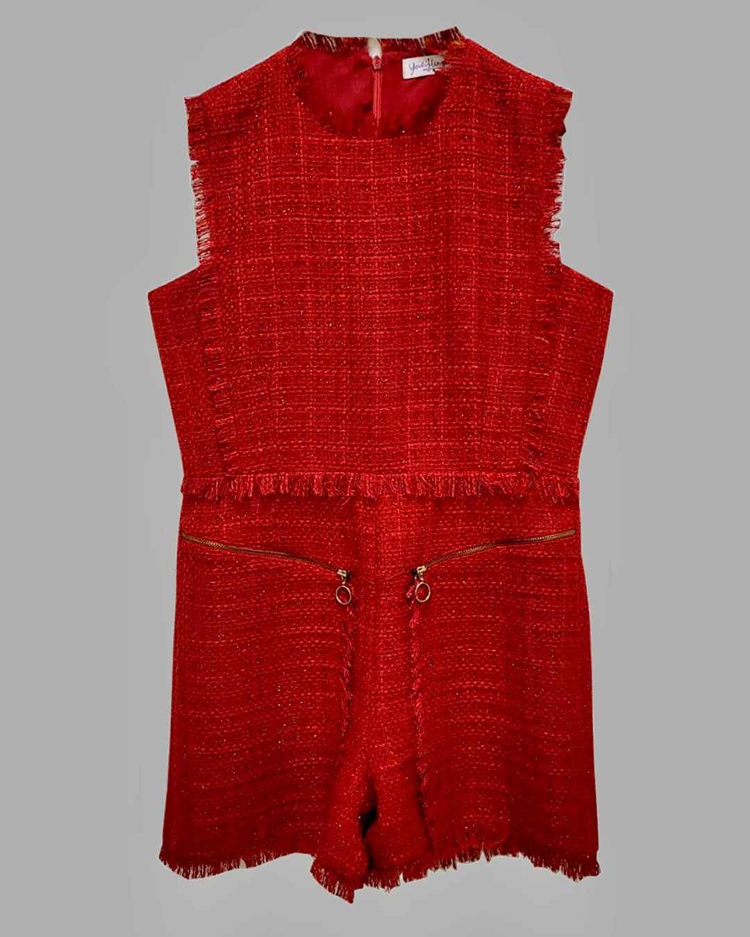 SCARLET SLEEVELESS PLAYSUIT WITH RAW EDGES DETAILING AND A ZIP FASTENING.