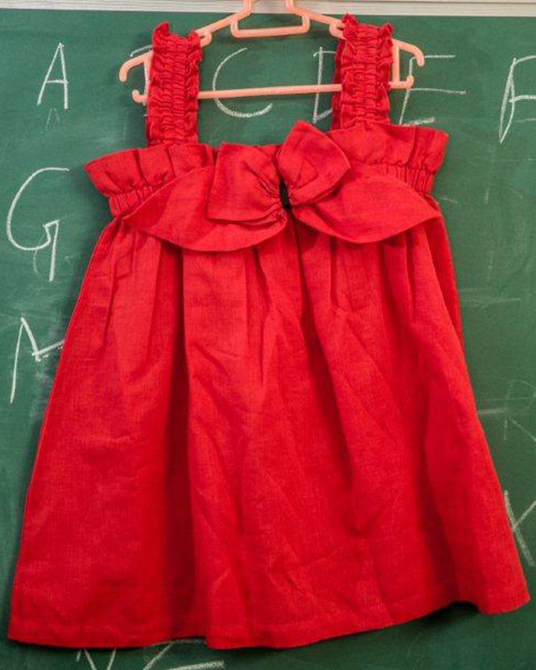STRIKING RED LINEN DRESS WITH A GIANT EYE POPPING BOW