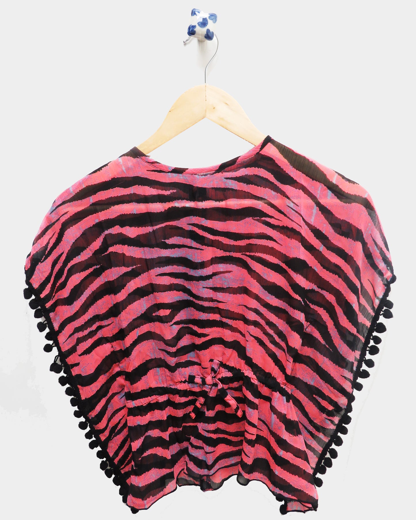 PINK AND BLACK PRINTED KAFTAN WITH POM POM DETAILING,HAS A ROUND NECK,SHORT KAFTAN SLEEVES