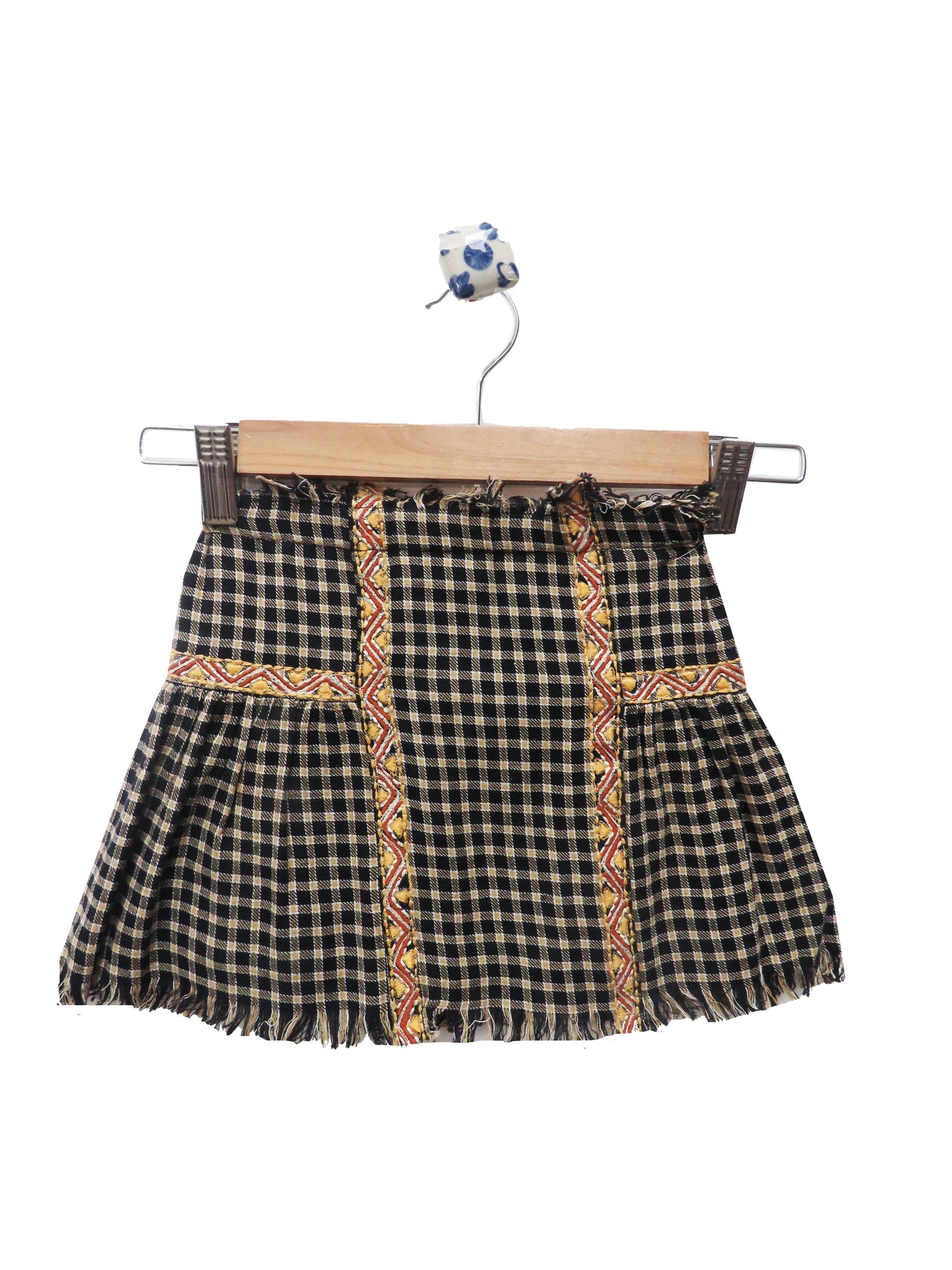 BLACK CHECKERED SKIRTS WITH EMBROIDERY AND FRINGES